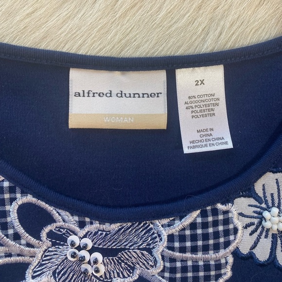 Alfred Dunner navy blue top featuring prominent white floral embroidery - Picture 9 of 10